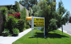 Bail Hotline Rancho Cucamonga roadside sign on a landscaped lawn