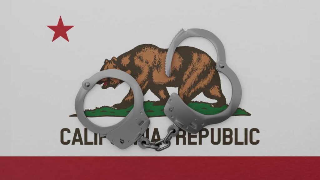 An image of the California state flag with a pair of handcuffs on top