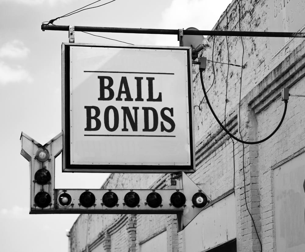 Sign for bail bonds in bakersfield california shown in black and white