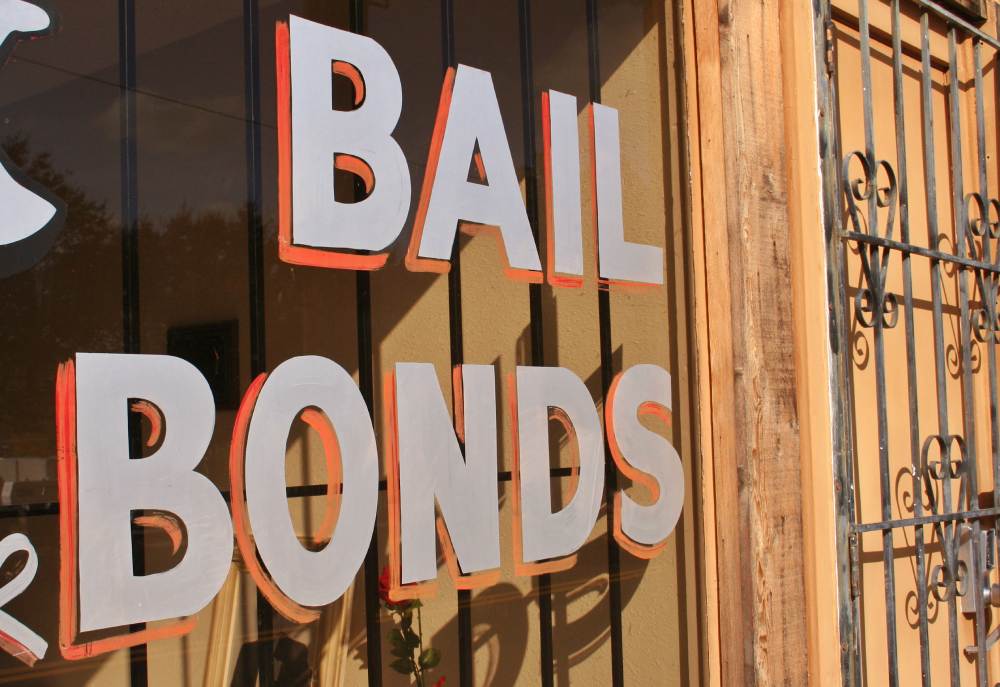 A storefront that reads “bail bonds”