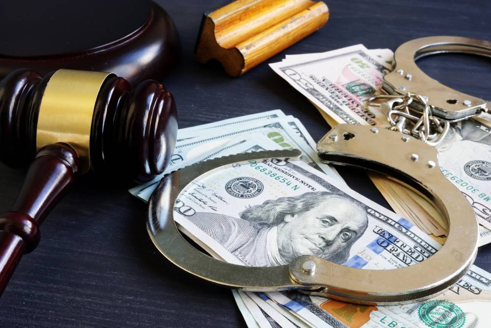 Handcuffs, a gavel and cash