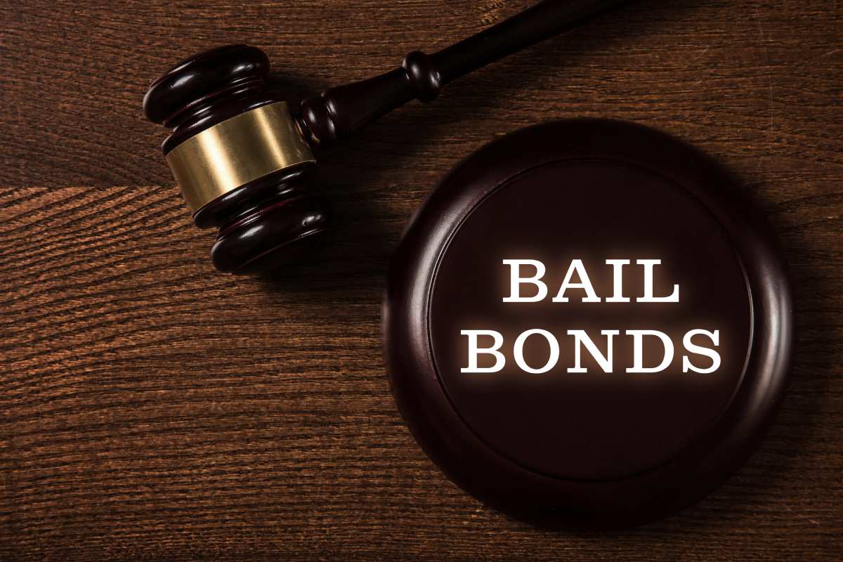 White capital letters spelling bail bonds graphic overlay on judges gavel