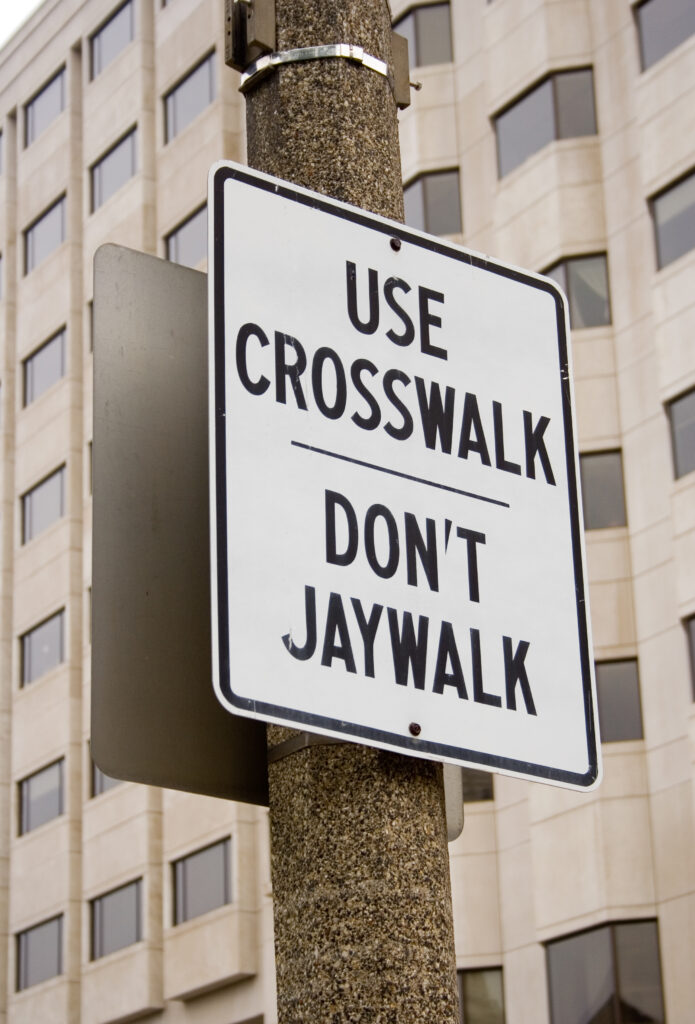 A California street sign that says ‘Use Crosswalk – Don't Jaywalk’