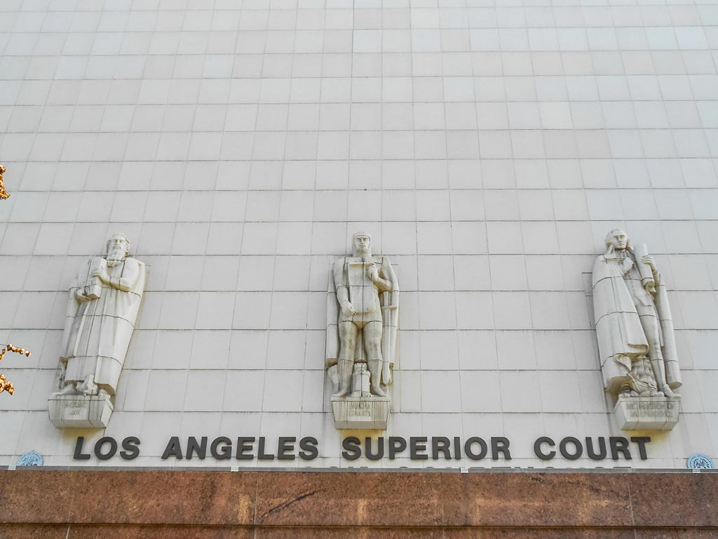 A view of three statues built into a Los Angeles Superior Court building.