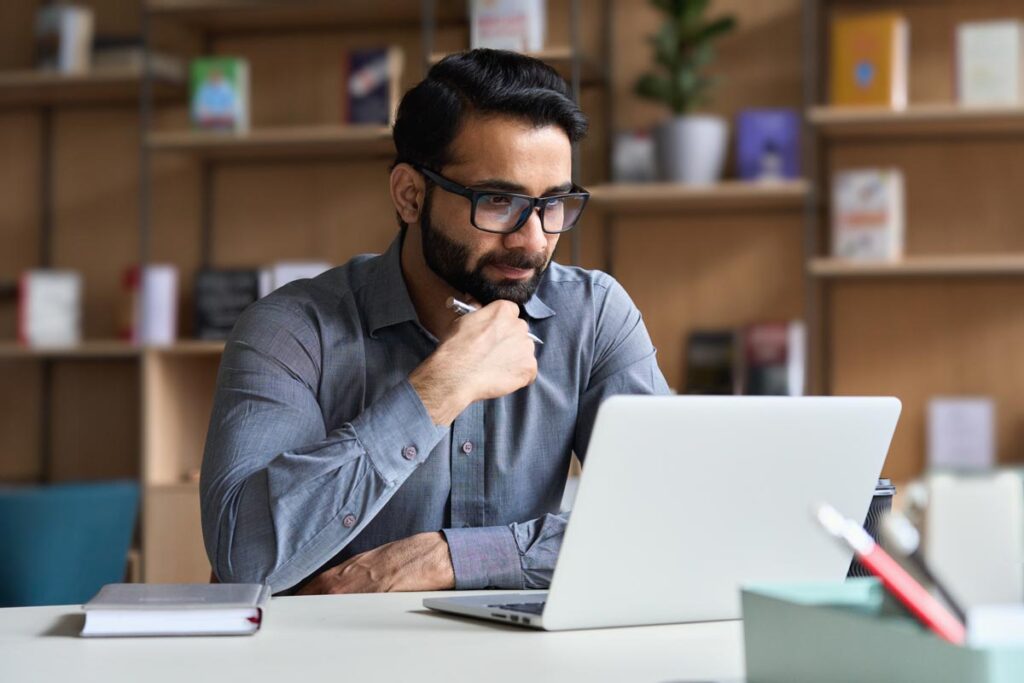 A man on a zoom call on his computer