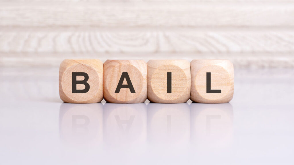 The word Bail is spelled out on wooden blocks.