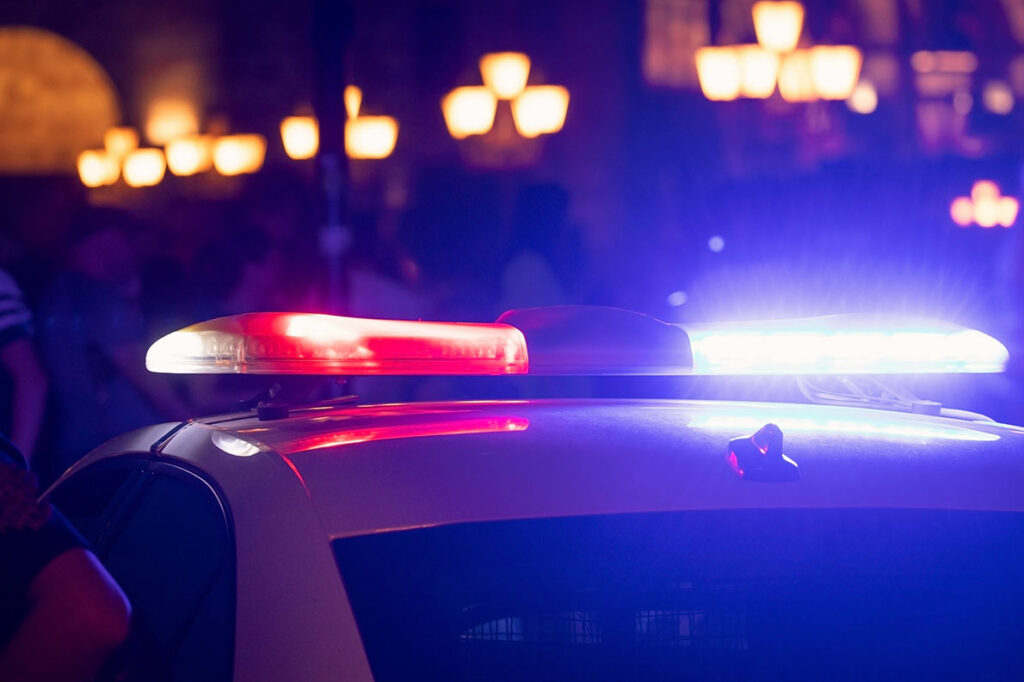 Flashing lights seen on top of a police car.