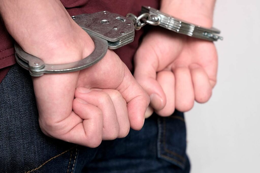 A man in handcuffs.