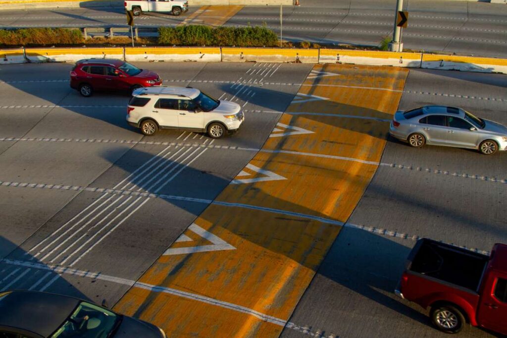 Cars drive toward the San Ysidro border crossing.